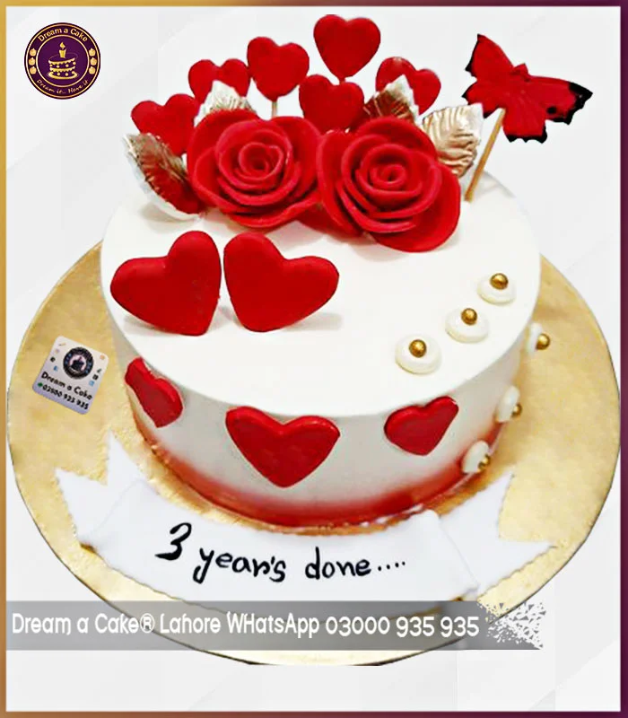 Red Flowers and Butterfly Cake for 3rd Anniversary in Lahore