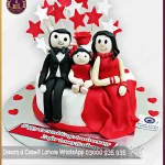 Personalized and Delicious 1st Anniversary Cake with Couple and Kid Characters in Lahore