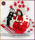 Personalized and Delicious 1st Anniversary Cake with Couple and Kid Characters in Lahore