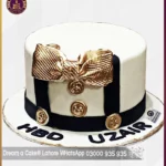 A Dapper Dessert Gentleman's Golden Bow Tie Cake in Lahore