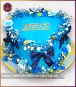 Elegant Blue Floral Birthday Theme Cake in Lahore